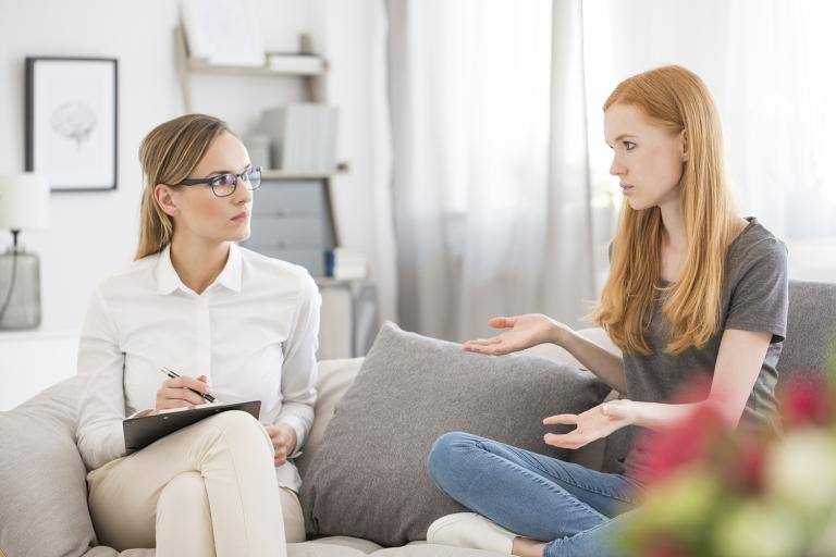 a young woman talking to her therapist